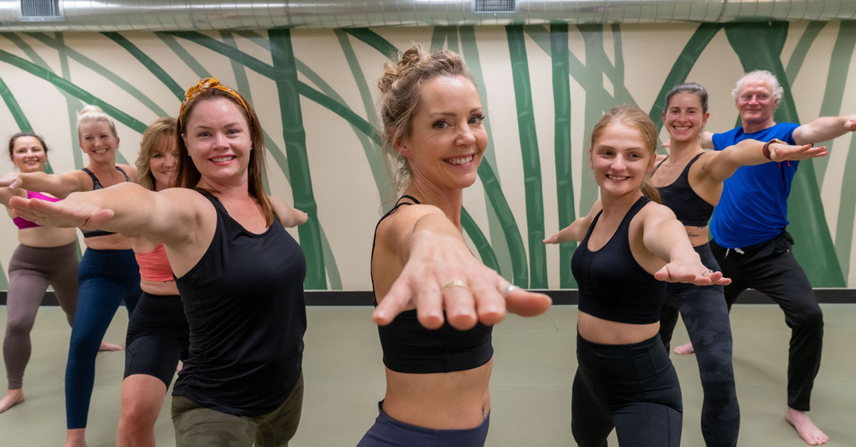 Healthy men and women practicing Yoga at Longevita Pilates and Yoga in Auburn WA