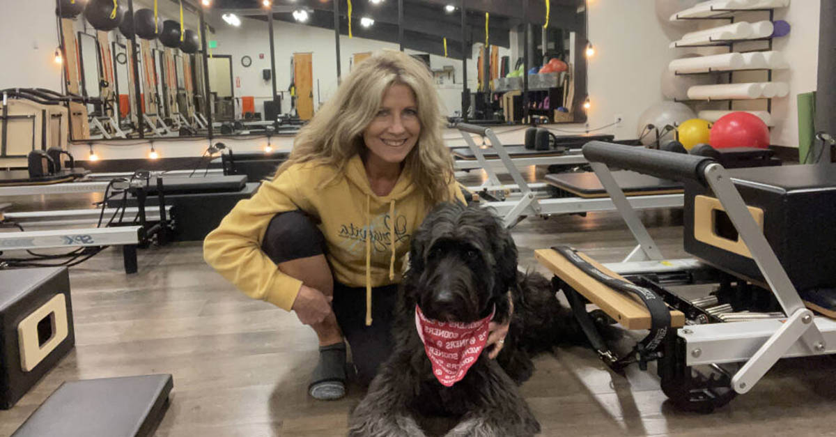 Shelia Cowart and her dog at Longevita Pilates and Yoga Studio in Auburn WA